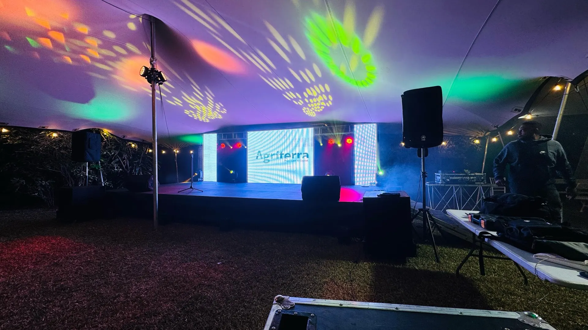 Corporate event under a stretch tent with projection lighting, LED screens and stage built by Verso in Mauritius